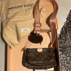 Like new! Used the bigger purse once. I have the box and original tags.